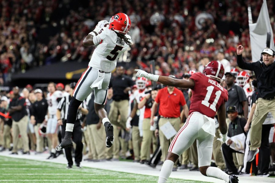 Georgia cornerback Kelee Ringo intercepts Bryce Young’s pass attempt for a touchdown late in the fourth quarter.
