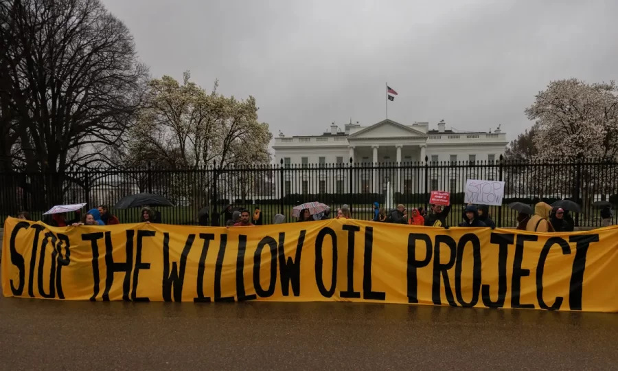 People stand outside The White House protesting the ConocoPhillips’ Willow Project. 