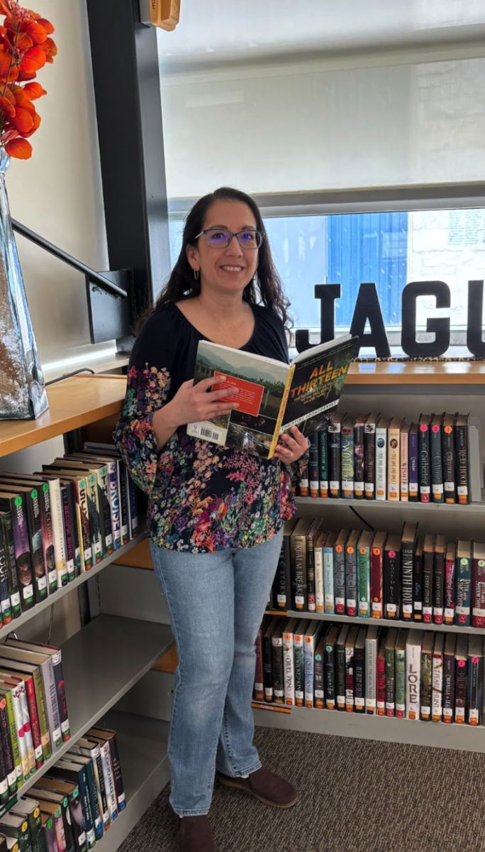 EWS librarian, Stephanie Hatley, enjoying a reading break in the library.